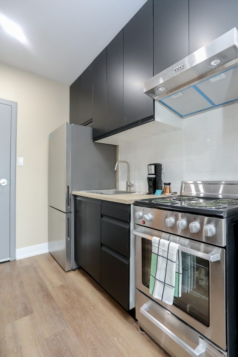 New modern kitchen with stainless steel appliances.