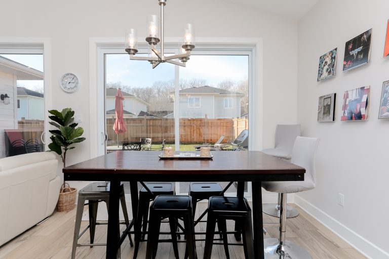 Square dining table with tall stools.