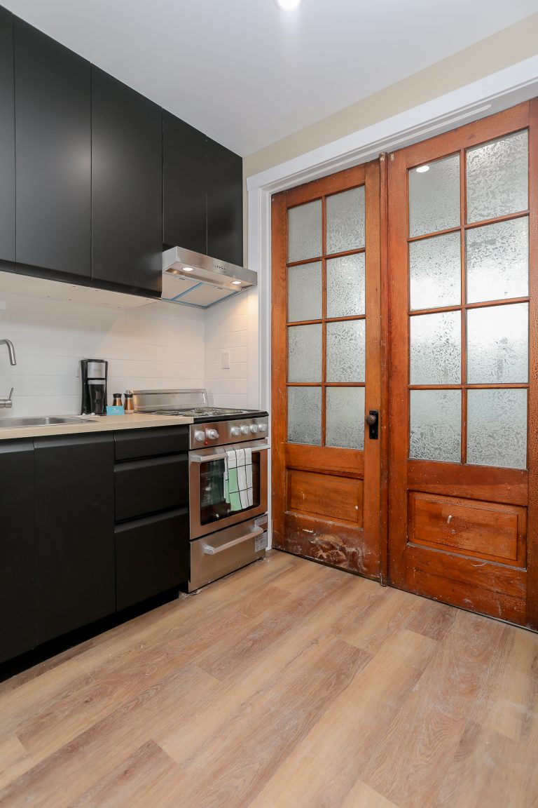Modern kitchen with natural wood french doors.
