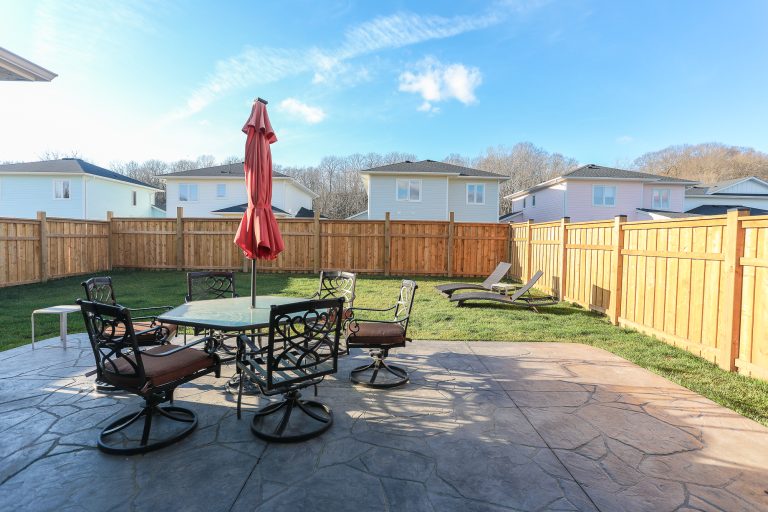 Backyard patio with outdoor patio furniture.