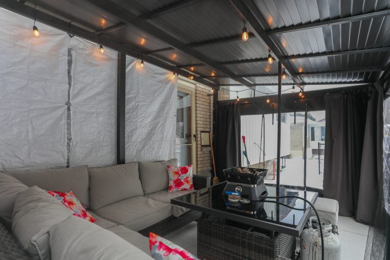 outdoor covered patio with outdoor furniture.