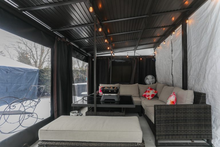 outdoor covered patio with outdoor furniture.