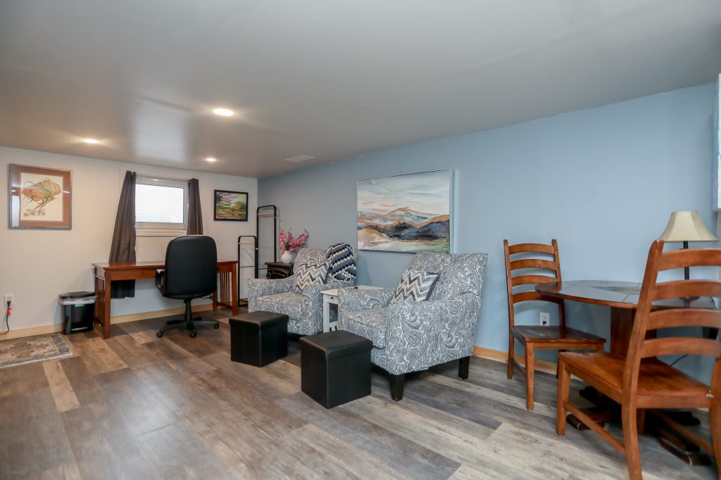 One room apartment with living room and office area.